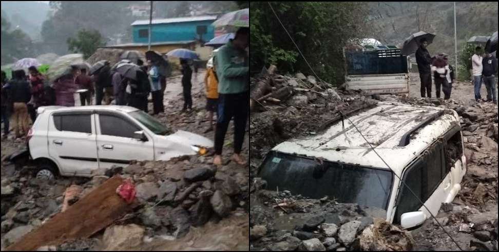Vehicles buried under debris due to heavy rain in Tharali