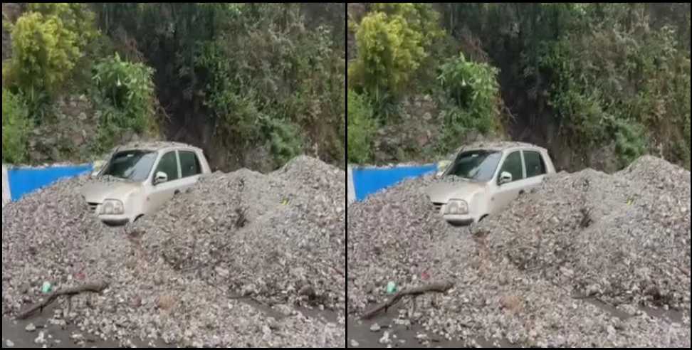 dehradun mussoorie road car debris: Car buried under debris on Dehradun Mussoorie road