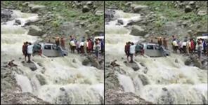 image: Car stuck in drain in Pithoragarh