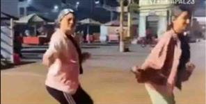 image: Two girls made reel on Har ki Paidi