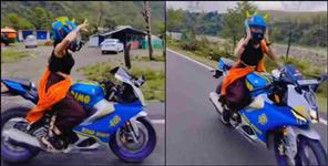 image: Dehradun girl bike stunt police action