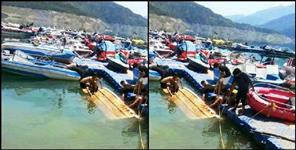 image: boats drown in water as storm hits Tehri lake