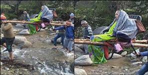 image: Villagers of bhimtal walk 9 km to hospital for sick woman