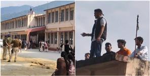 image: Students climbed roof of PG college in Agastyamuni with petrol