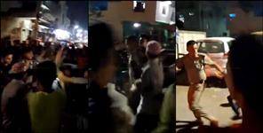 image: policeman beaten by mob during religious procession