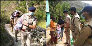 image: Almora police helping people during lockdown