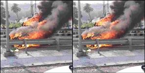 image: A moving car overturned on the road in Dehradun