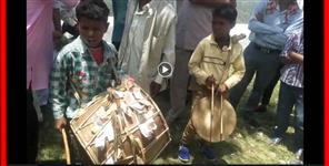 image: Two boys of garhwal playing dhol damau  