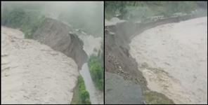 image: Black river flowing above danger mark in Pithoragarh