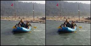 image: Tourists stranded amidst the river in Rishikesh