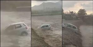 image: Car washed away in rain drain in Vikasnagar