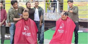 image: District Panchayat members protested by shaving their heads