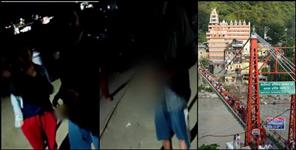 image: Boy and girl drinking liquor at ganga Bank in rishikesh