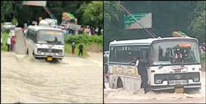 image: Roadways Bus stuck between water waves in Haldwani