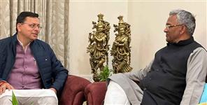 image: CM Pushkar Singh Dhami and Trivendra Singh Rawat met