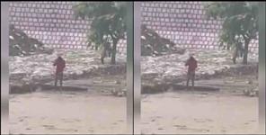 image: Boy started apologizing to the river in Rishikesh