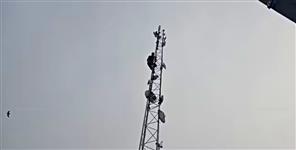 image: Shopkeeper Anup Thapliyal climbed the mobile tower with petrol