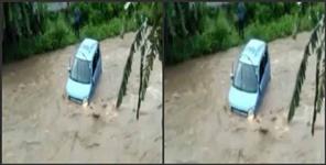 image: Uttarakhand a car in the water