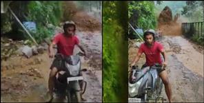 image: Bike rider narrowly saved from landslide in Pithoragarh