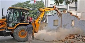 image: Bulldozer action on illegal encroachment in rishikesh