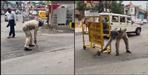 Policeman sweeps the road in Dehradun